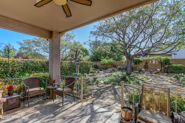 5461 N Bremont Way, Prescott Valley, AZ 86314 - fenced backyard with a ceiling fan and a patio