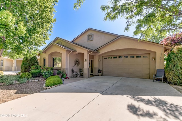 5461 N Bremont Way, Prescott Valley, AZ 86314 - view of front of property with stucco siding, concrete driveway, and a garage