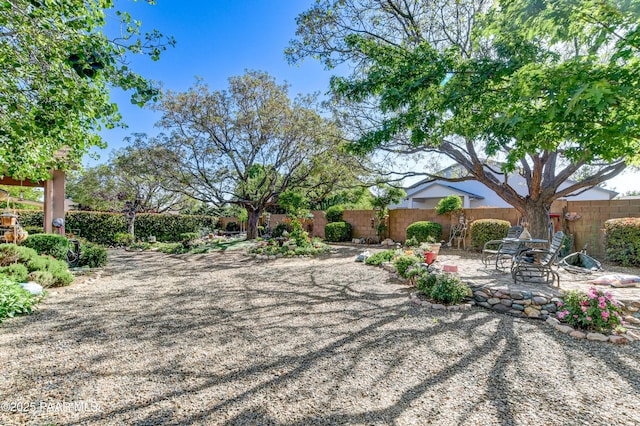 5461 N Bremont Way, Prescott Valley, AZ 86314 - fenced backyard with a patio area