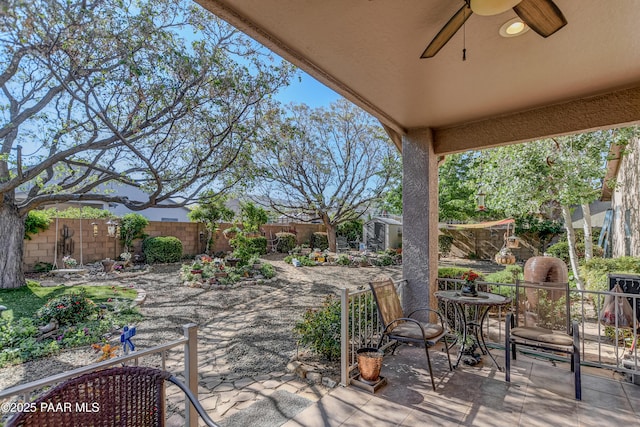 5461 N Bremont Way, Prescott Valley, AZ 86314 - fenced backyard with a ceiling fan and a patio area