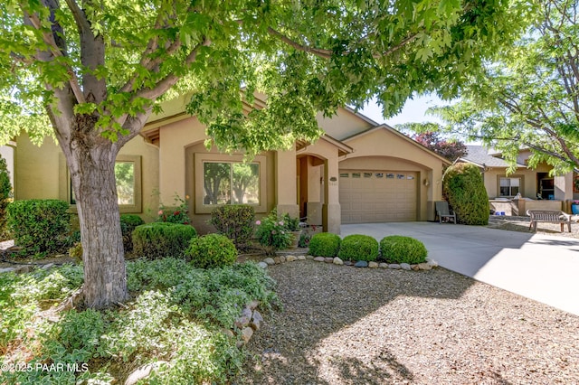 5461 N Bremont Way, Prescott Valley, AZ 86314 - view of front of home with a garage, stucco siding, and driveway