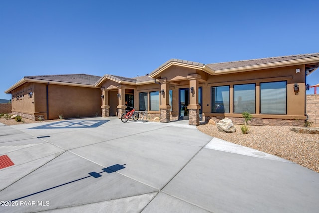 5461 N Bremont Way, Prescott Valley, AZ 86314 - view of front facade with stone siding, stucco siding, and a tile roof