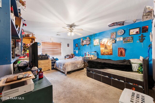 carpeted bedroom featuring ceiling fan