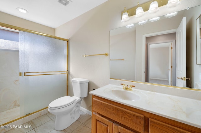 bathroom featuring vanity, toilet, and a shower with shower door