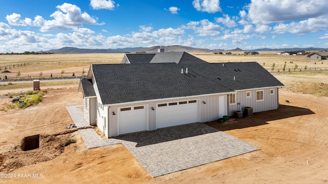 exterior space featuring a mountain view and a garage