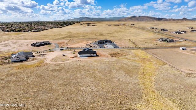 birds eye view of property featuring a mountain view and a rural view