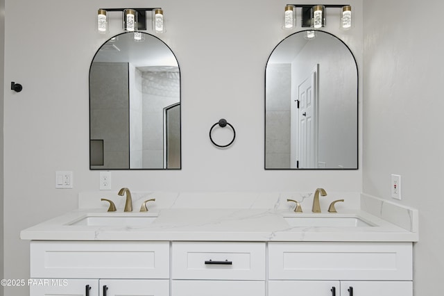 bathroom featuring a sink and double vanity