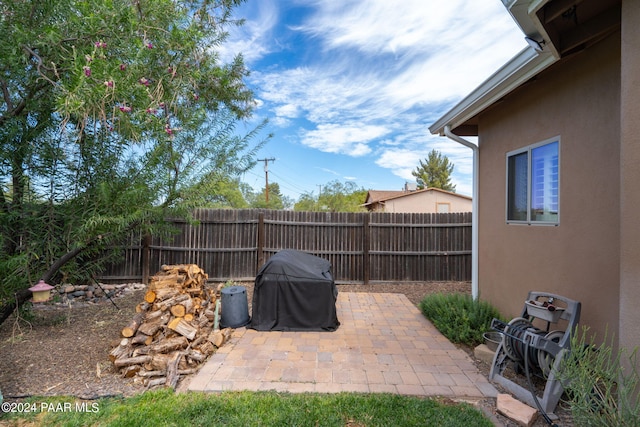 view of patio featuring a grill