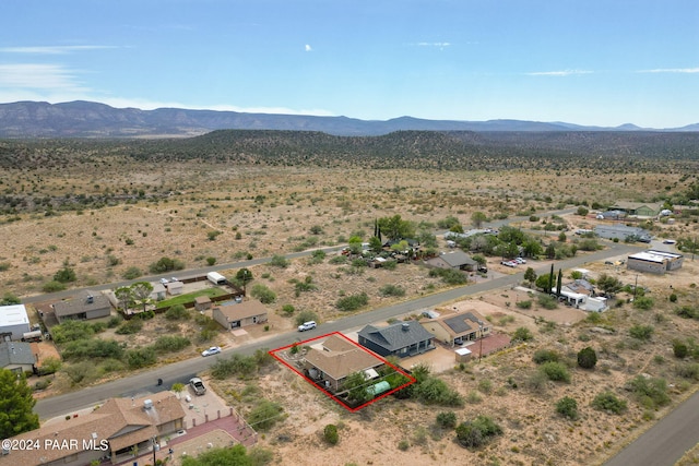 birds eye view of property with a mountain view