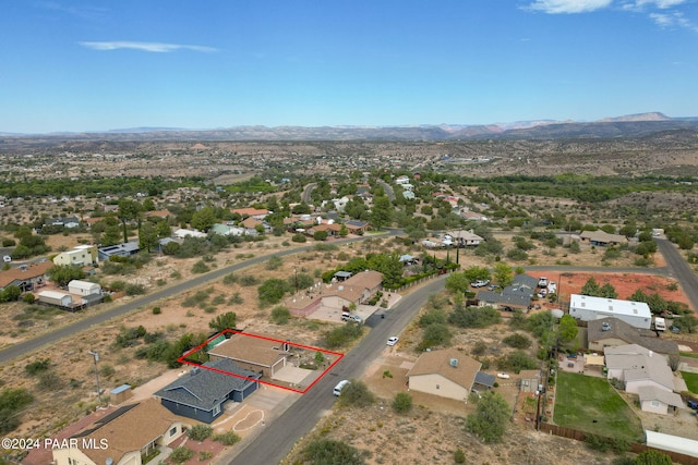 birds eye view of property featuring a mountain view