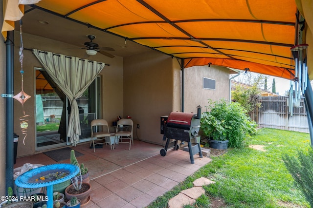 view of patio / terrace featuring ceiling fan and a grill