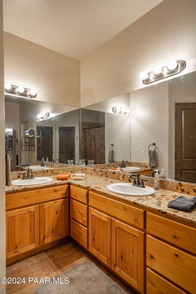 bathroom featuring tile patterned floors, vanity, and a shower with curtain