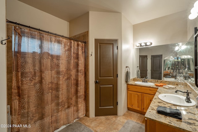 bathroom with tile patterned floors and vanity