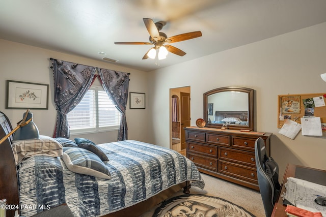 bedroom featuring ceiling fan and light carpet