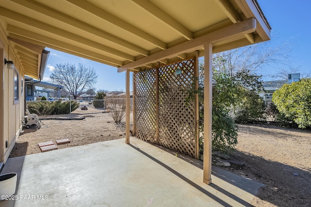 view of patio / terrace featuring fence