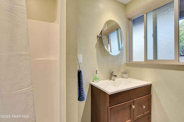 1520 W Sylvan Dr, Prescott, AZ 86305 - bathroom with vanity, a shower with shower curtain, and a textured wall