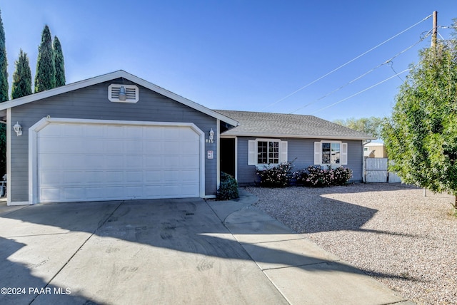 ranch-style home featuring a garage