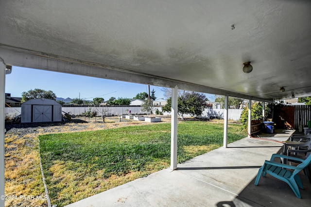 view of patio / terrace with a shed