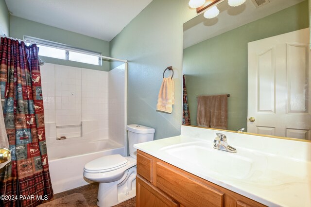 full bathroom with vanity, toilet, and shower / tub combo with curtain