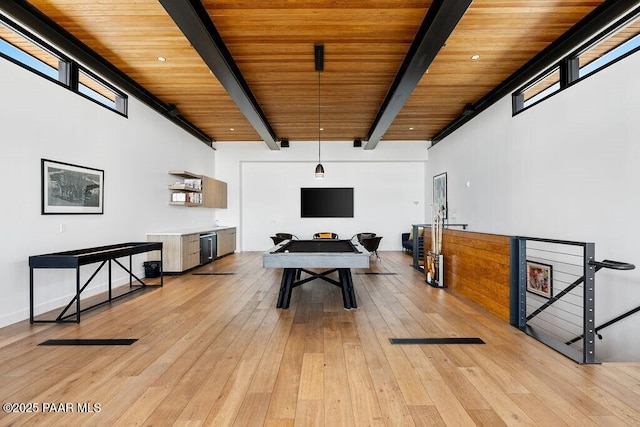 rec room with beamed ceiling, light wood finished floors, and wooden ceiling