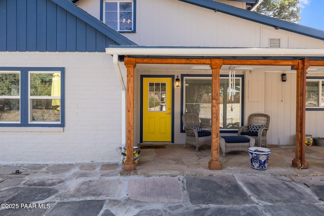 1467 N Vyne St, Prescott, AZ 86305 - view of exterior entry featuring brick siding and a patio area