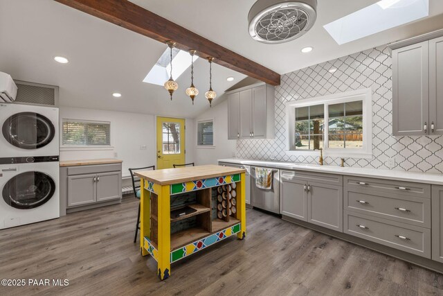 1467 N Vyne St, Prescott, AZ 86305 - kitchen featuring gray cabinetry, wooden counters, stacked washer and dryer, a sink, and dishwasher