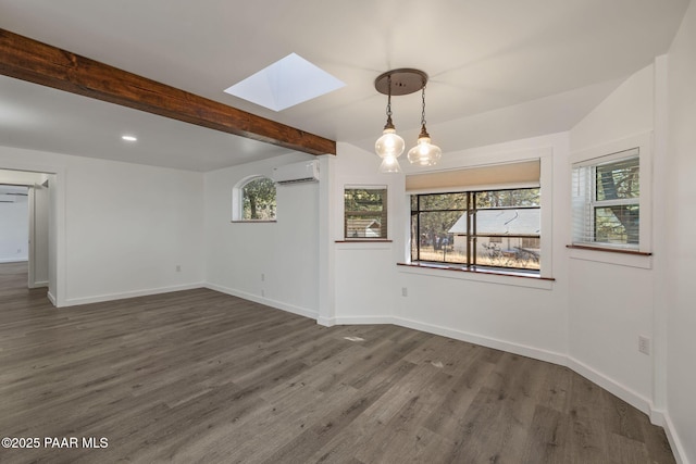1467 N Vyne St, Prescott, AZ 86305 - empty room with dark wood-style floors, a skylight, beamed ceiling, and an AC wall unit