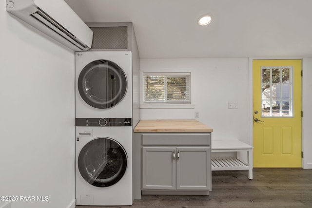 1467 N Vyne St, Prescott, AZ 86305 - laundry area featuring recessed lighting, stacked washer and dryer, cabinet space, a wall mounted air conditioner, and wood finished floors
