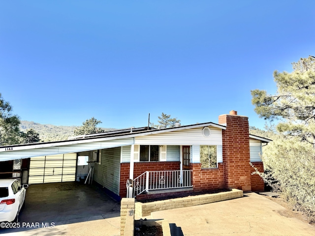 view of front of home featuring a carport