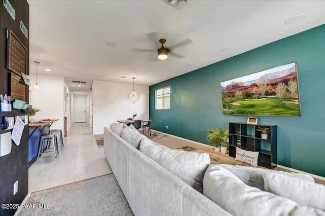 10429 W Crown King Rd, Tolleson, AZ 85353 - living room featuring ceiling fan, baseboards, and light tile patterned floors
