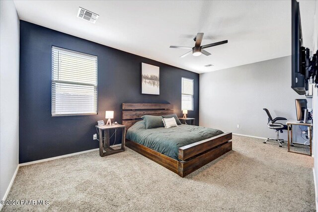 10429 W Crown King Rd, Tolleson, AZ 85353 - carpeted bedroom with baseboards, a ceiling fan, and a desk