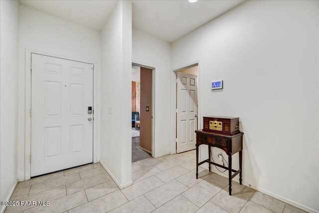 10429 W Crown King Rd, Tolleson, AZ 85353 - foyer entrance featuring light tile patterned floors and baseboards
