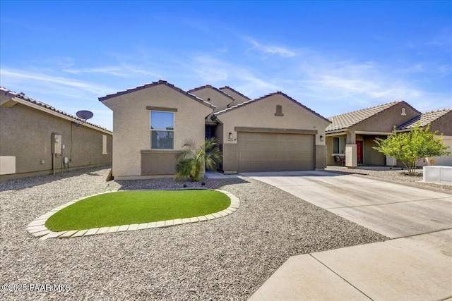 10429 W Crown King Rd, Tolleson, AZ 85353 - view of front facade with concrete driveway, an attached garage, stucco siding, and a tile roof