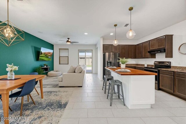 10429 W Crown King Rd, Tolleson, AZ 85353 - kitchen with stainless steel appliances, dark brown cabinets, a breakfast bar, under cabinet range hood, and recessed lighting