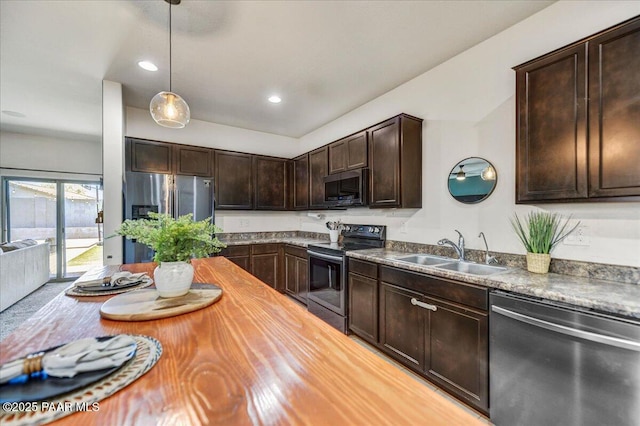 10429 W Crown King Rd, Tolleson, AZ 85353 - kitchen featuring stainless steel appliances, a sink, dark brown cabinetry, pendant lighting, and recessed lighting
