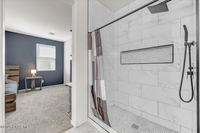 10429 W Crown King Rd, Tolleson, AZ 85353 - ensuite bathroom featuring a stall shower and baseboards