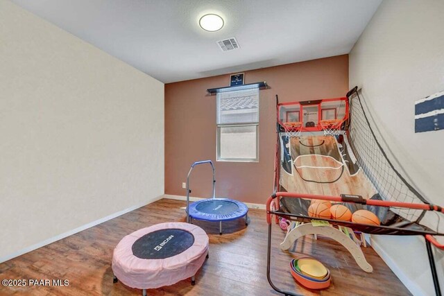 10429 W Crown King Rd, Tolleson, AZ 85353 - recreation room featuring wood finished floors and baseboards