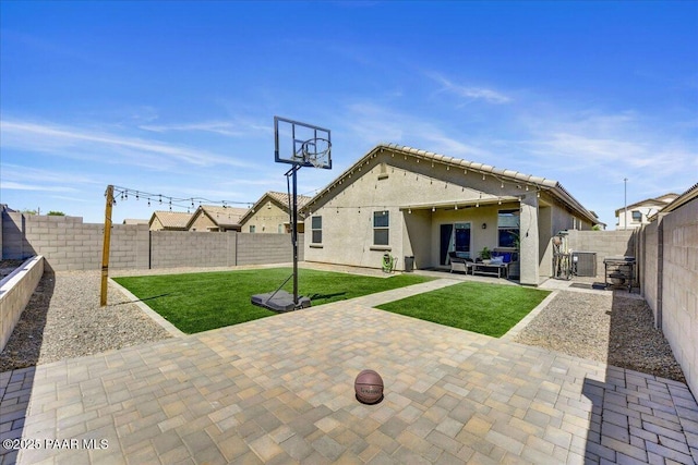 10429 W Crown King Rd, Tolleson, AZ 85353 - back of property featuring outdoor lounge area, a patio, stucco siding, and central AC