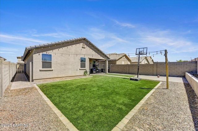 10429 W Crown King Rd, Tolleson, AZ 85353 - back of house featuring stucco siding and a patio area