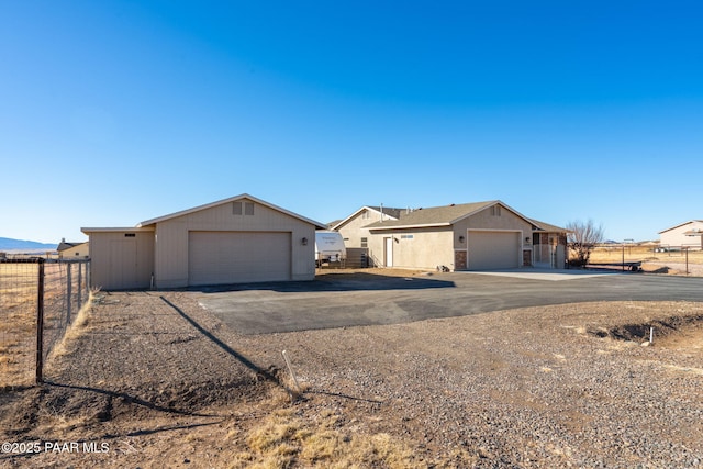 single story home featuring a garage