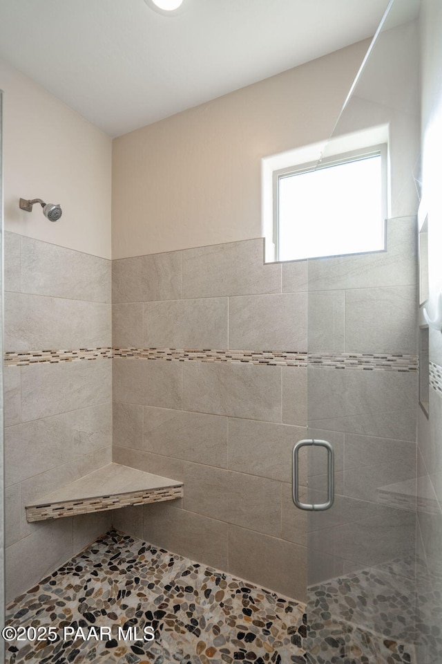 bathroom featuring an enclosed shower