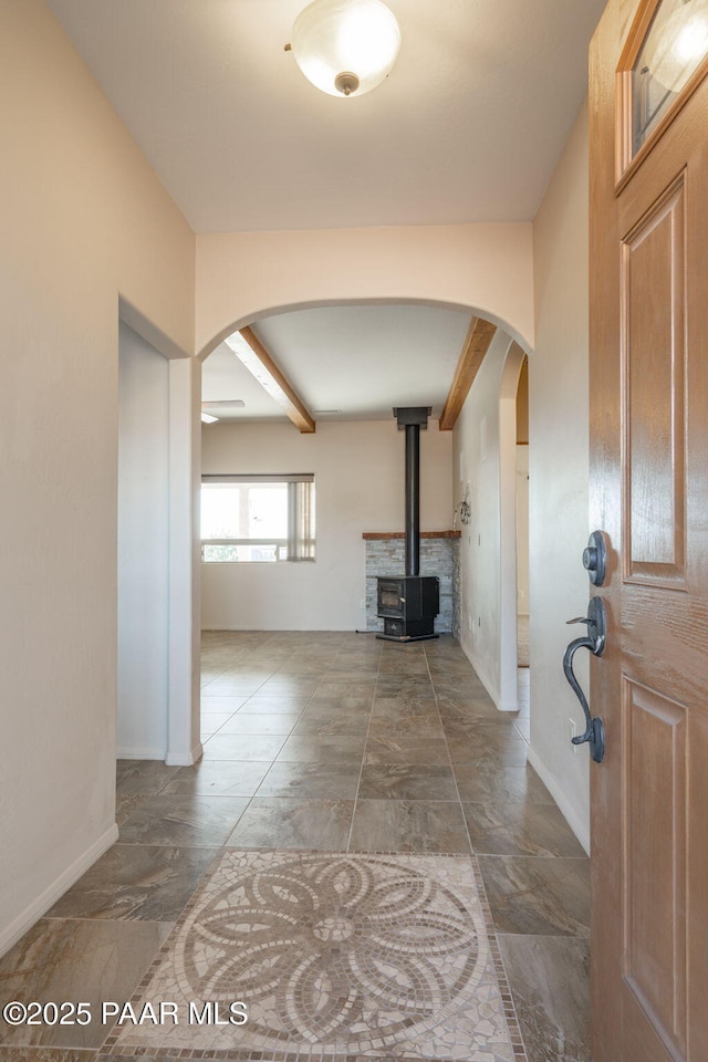 interior space featuring beam ceiling