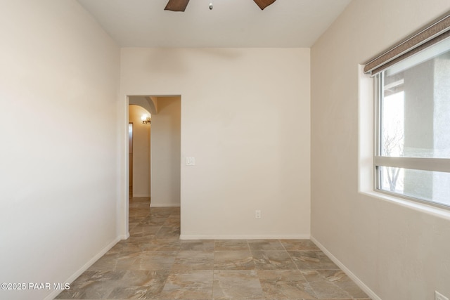 spare room with ceiling fan