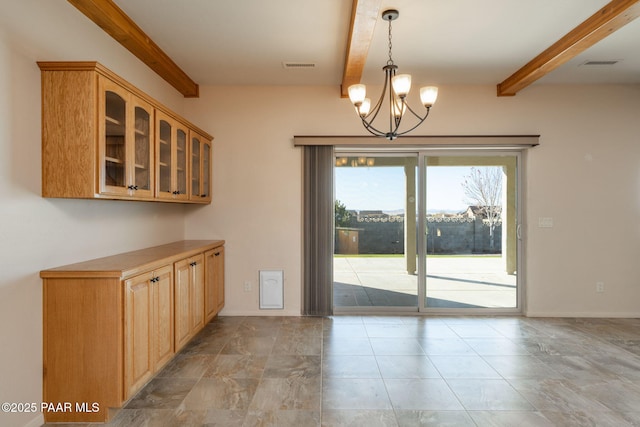 unfurnished dining area with a notable chandelier and beamed ceiling