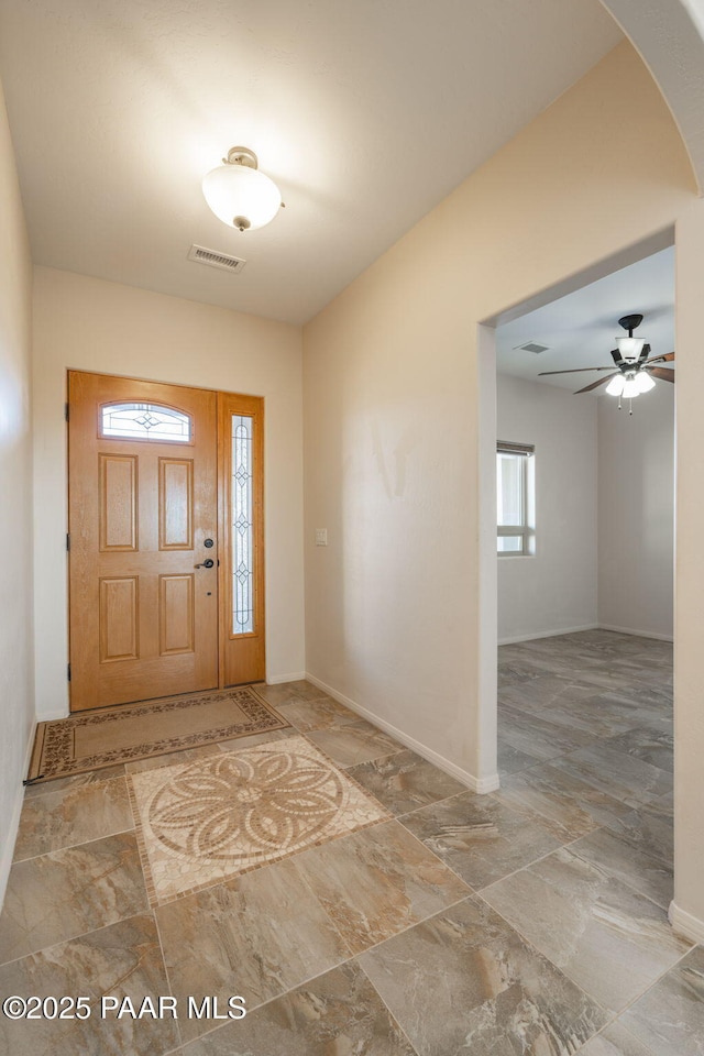 foyer featuring ceiling fan