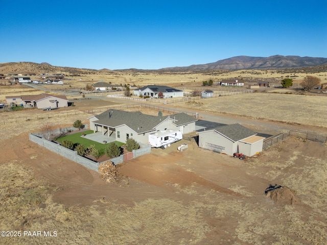 birds eye view of property with a mountain view