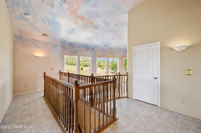 18900 N Butte Pass Rd, Prescott, AZ 86305 - hallway featuring an upstairs landing, tile patterned floors, baseboards, and lofted ceiling