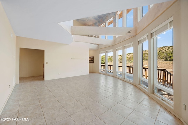 18900 N Butte Pass Rd, Prescott, AZ 86305 - spare room with light tile patterned floors and a high ceiling
