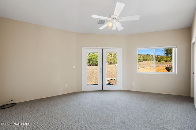 18900 N Butte Pass Rd, Prescott, AZ 86305 - carpeted spare room featuring french doors, plenty of natural light, ceiling fan, and baseboards