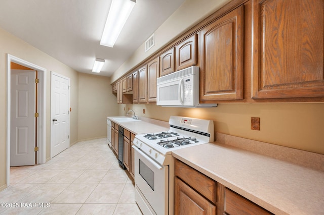 18900 N Butte Pass Rd, Prescott, AZ 86305 - kitchen with white appliances, a sink, light countertops, light tile patterned floors, and brown cabinets